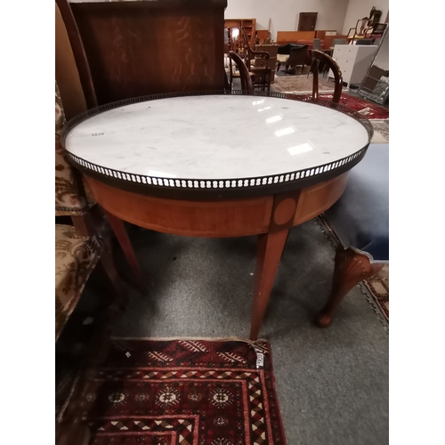 1219 - An Antique French centre table with marble to and brass gallery in a fruitwood  decorationCondition ... 