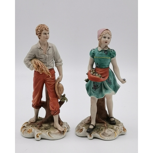 308 - Two Capodimonte figures by Sandro Maggioni, a girl picking flowers and a boy carrying wheat, blue pr... 