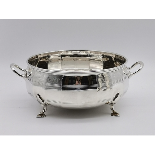 340 - A group of silver-plated wares, comprising a large twin-handled bowl by Mappin & Webb, the faceted e... 