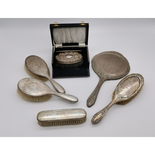 362 - A quantity of silver-backed dressing table articles, 20th Century, comprising a George V hairbrush a... 