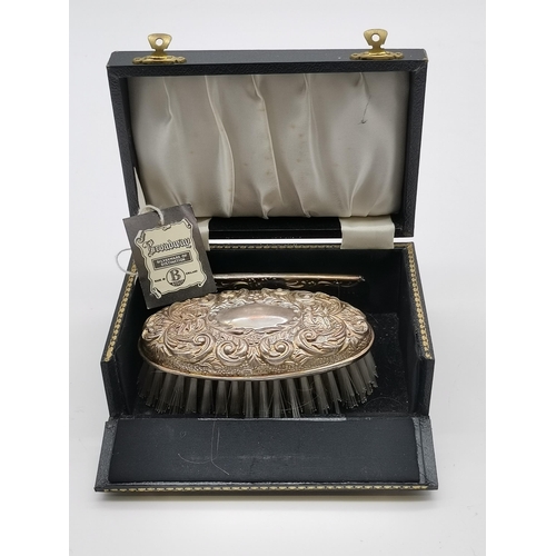 362 - A quantity of silver-backed dressing table articles, 20th Century, comprising a George V hairbrush a... 