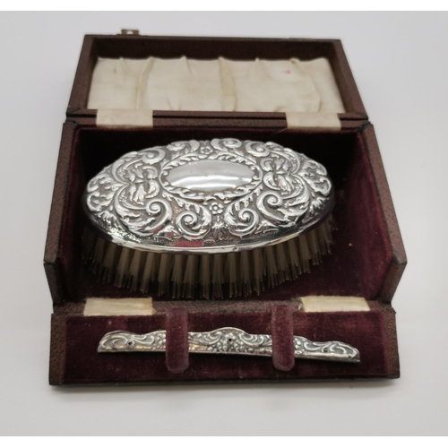 410 - An Elizabeth II silver-backed hairbrush and comb set by W I Broadway & Co, Birmingham 1956 & 1957, r... 