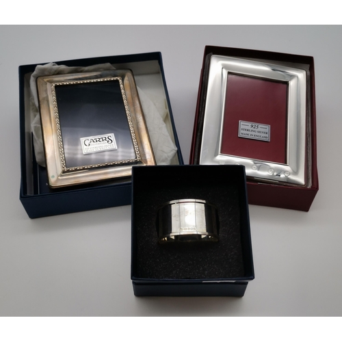 419 - A small group of Elizabeth II silver comprising a photograph frame by Carr's of Sheffield Ltd, Sheff... 