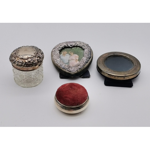 420 - A mixed group of assorted small silver, various makers and dates, including miniature photograph fra... 