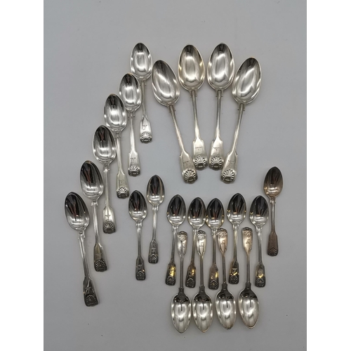 423 - A quantity of Victorian silver spoons, Fiddle, thread and shell pattern, by George William Adams, Lo... 