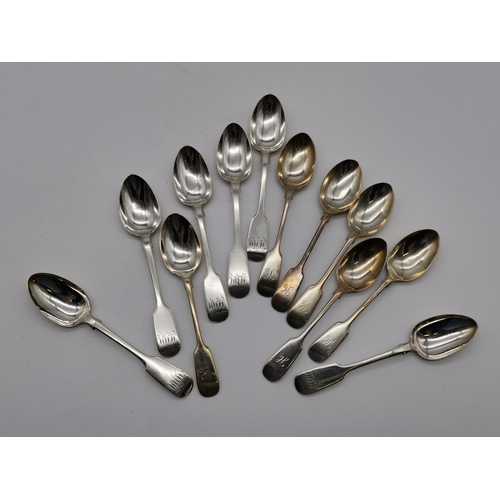 423 - A quantity of Victorian silver spoons, Fiddle, thread and shell pattern, by George William Adams, Lo... 