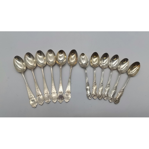 426 - A set of six Art Nouveau silver teaspoons by William Henry Leather, Birmingham 1904 and 1906, the te... 