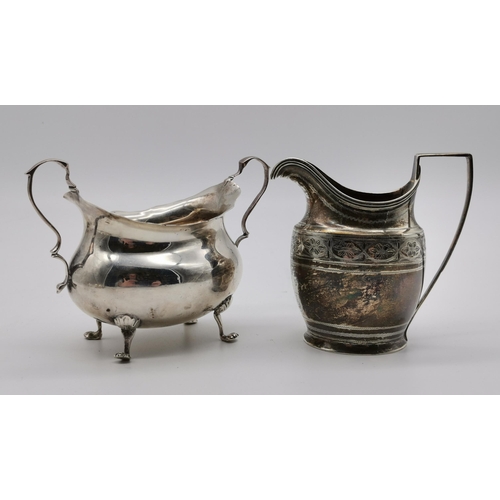 429 - A George III silver cream jug by Abraham Peterson, London 1798, oval with reeded edge and strap hand... 