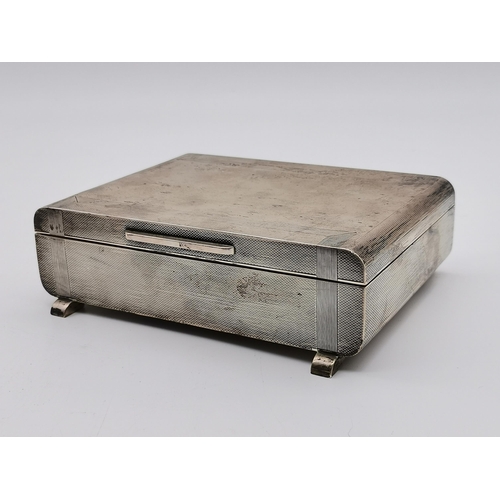 438 - A George VI silver table cigarette box by S J Rose & Son, London 1937, rectangular with rounded ends... 