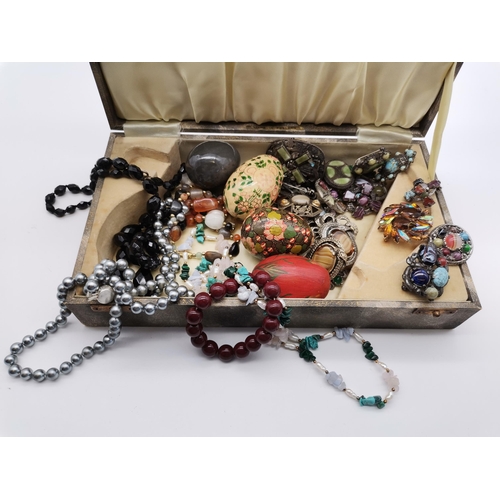 449A - A miscellaneous collection comprising a quantity of Scottish hardstone brooches, beaded necklaces, d... 