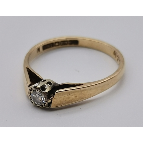 457 - A 9 carat gold solitaire diamond ring, the circular stone claw-set to raised openwork shoulders, hal... 