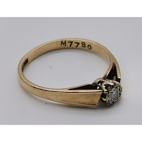 457 - A 9 carat gold solitaire diamond ring, the circular stone claw-set to raised openwork shoulders, hal... 