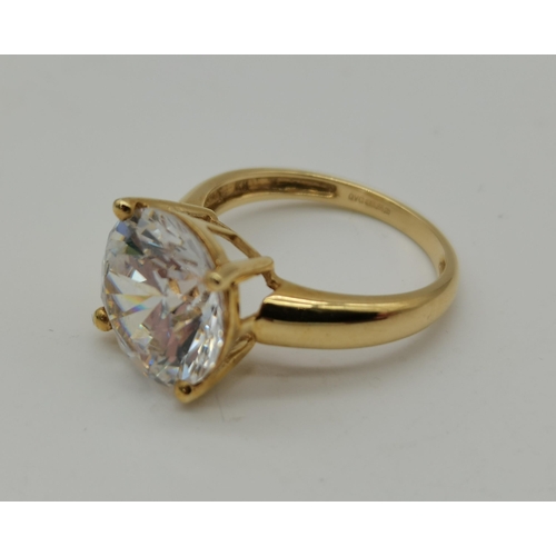 458 - A 14 carat gold solitaire ring, the large circular cubic zirconia claw-set to an openwork mount, hal... 