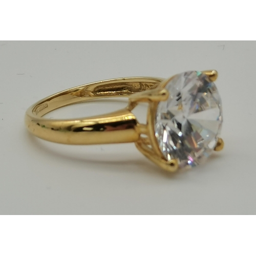 458 - A 14 carat gold solitaire ring, the large circular cubic zirconia claw-set to an openwork mount, hal... 