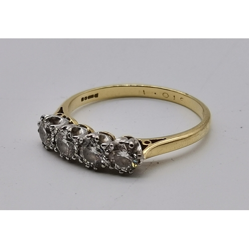 459A - An 18 carat gold diamond ring, the four stones claw-set to white metal mounts, hallmarked 750. Ring ... 