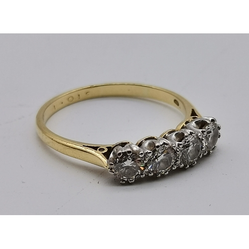 459A - An 18 carat gold diamond ring, the four stones claw-set to white metal mounts, hallmarked 750. Ring ... 