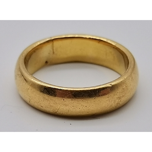 486 - A 22 carat gold band ring, hallmarked 22. Ring size H1/2, 5.7g