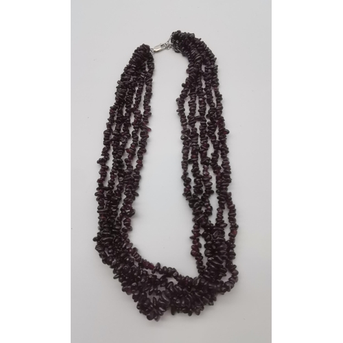 500 - A five strand garnet necklace, with silver lobster claw clasp. Approx. 48cm long