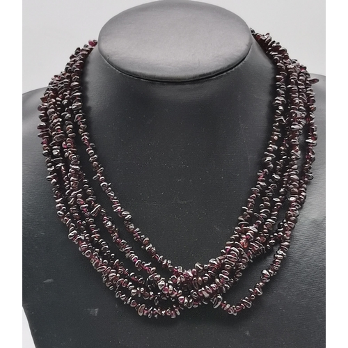 500 - A five strand garnet necklace, with silver lobster claw clasp. Approx. 48cm long