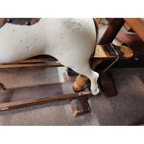 679 - A Victorian pine and painted child's rocking horse 1.3m x 1.1m