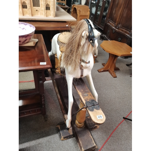 679 - A Victorian pine and painted child's rocking horse 1.3m x 1.1m