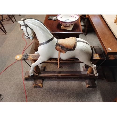 679 - A Victorian pine and painted child's rocking horse 1.3m x 1.1m