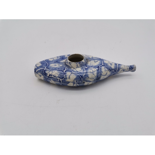 54 - A small collection of assorted blue and white ceramic wares comprising a Delft charger; an oval dish... 