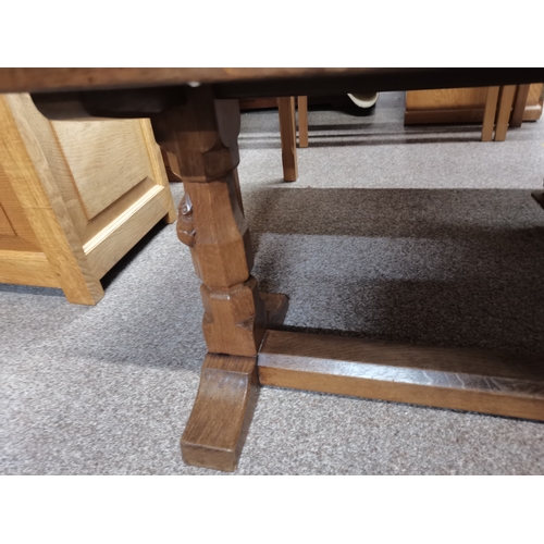 698 - Robert Thompson, a Mouseman oak coffee table, the lightly adzed rectangular top with rounded corners... 