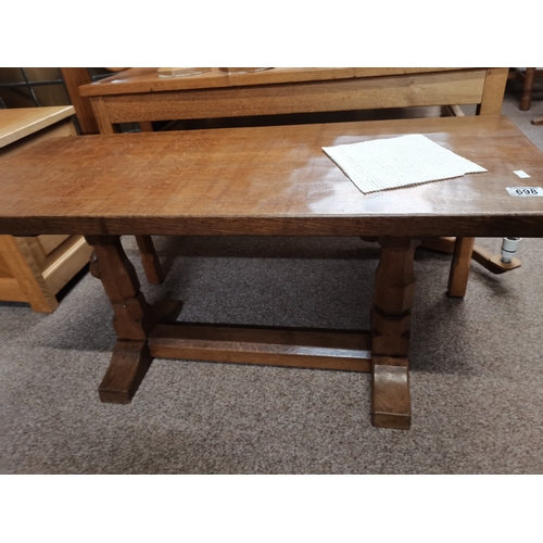 698 - Robert Thompson, a Mouseman oak coffee table, the lightly adzed rectangular top with rounded corners... 