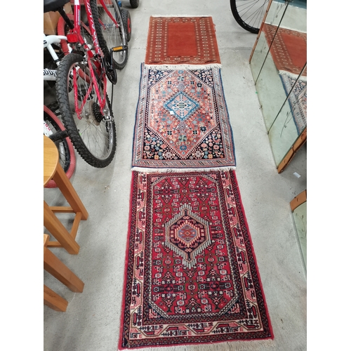 931 - Three small rugs - Two oriental hand made from Oriental rug gallery limited 62cm x 97cm red and blue... 