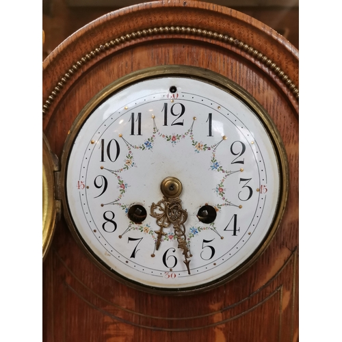 708 - Oak cased mantle clock with brass detailing with key and pendulum