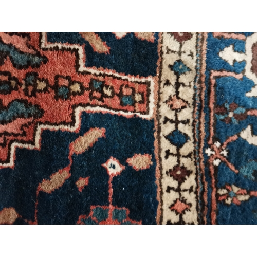 1149k - A large runner in mainly blue, red and cream highly decorated 3m x 90cm