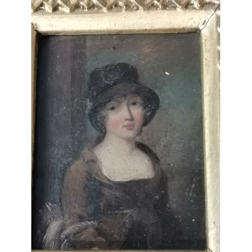 2 - A pair of portrait miniatures, early 19th Century, Young lady in brown coat and hat with basket on h... 