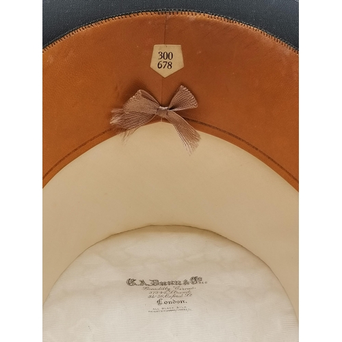 10 - A silk top hat by G. A. Dunn & Co, early 20th Century, labelled '300 / 678' to hatband; together wit... 