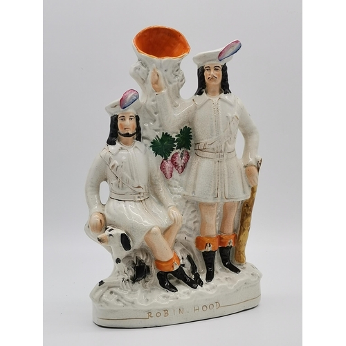 11 - A Staffordshire flat-back figure group, Harvest Couple; together with a Staffordshire spill vase fig... 