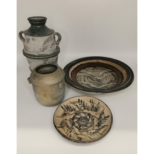 115 - A small collection of studio pottery pieces, comprising a large centrepiece bowl, plate and two vase... 