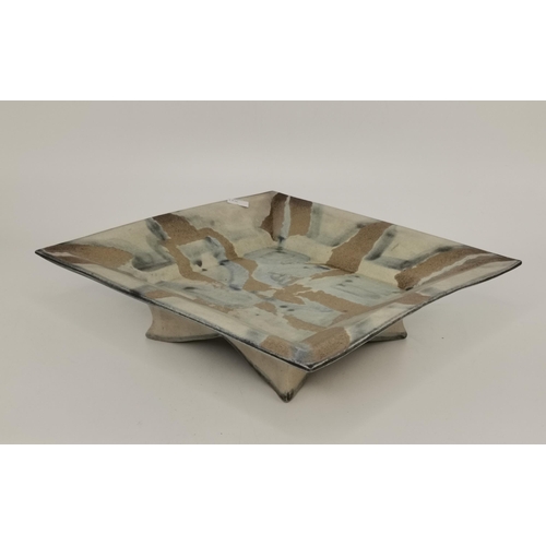 116 - Four pieces of studio pottery, comprising a square pedestal dish by Jackie Walton; a shallow twin-ha... 