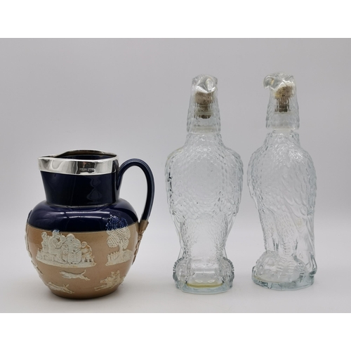 122 - Late 19th Century Royal Doulton Jug with silver rim plus Two Eagle decanters