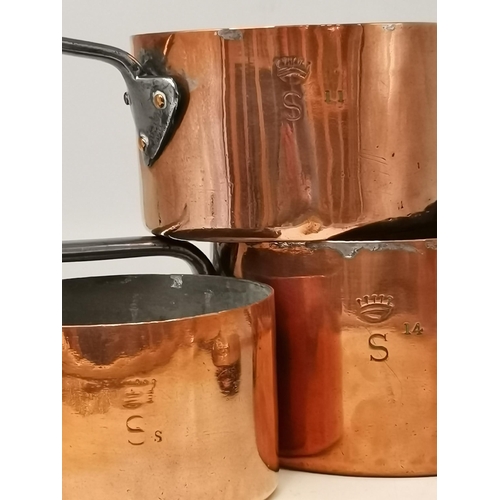 124 - A set of three English Copper Sauce pans with lids, one of them an early dovetailed Benham & Froud l... 