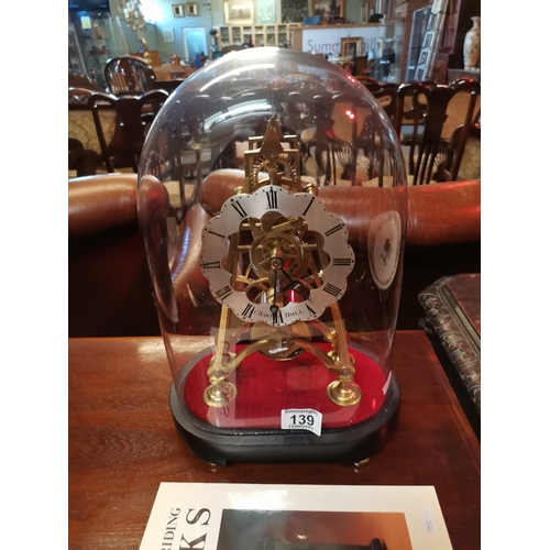 139 - Victorian skeleton clock with glass dome on ebonised base by C Hart Hull (1846 - 1863) 37cm height; ... 