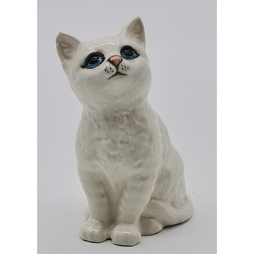 146 - A collection of Beswick animals including black and golden Labrador, White cat, Owl etc (7)