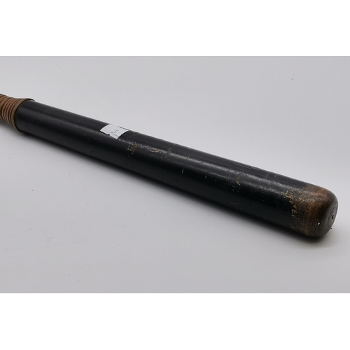 15 - An antique ebonised wooden truncheon, with turned handle. 45cm long