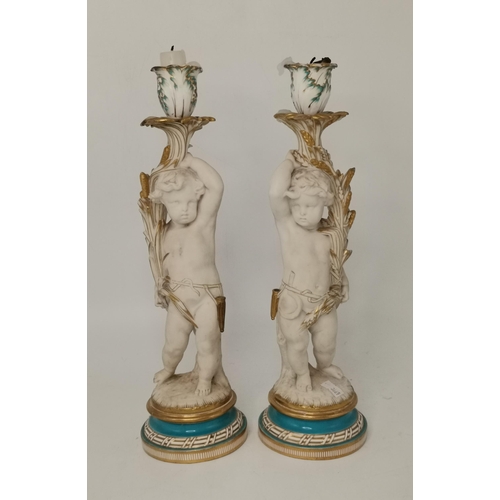 155 - Pair of antique porcelain cherub figure candleholders with turquoise and gilt trim to base 36cm heig... 