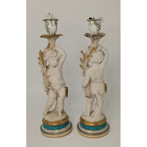 155 - Pair of antique porcelain cherub figure candleholders with turquoise and gilt trim to base 36cm heig... 