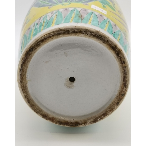 179 - A Chinese porcelain vase 19th century in a brilliant and vibrant yellow back ground and having peaco... 