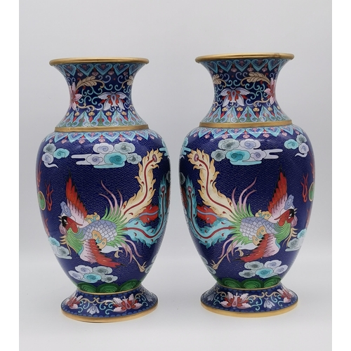 18 - A large pair of Chinese cloisonné vases, each decorated with a green five-toed dragon chasing a flam... 