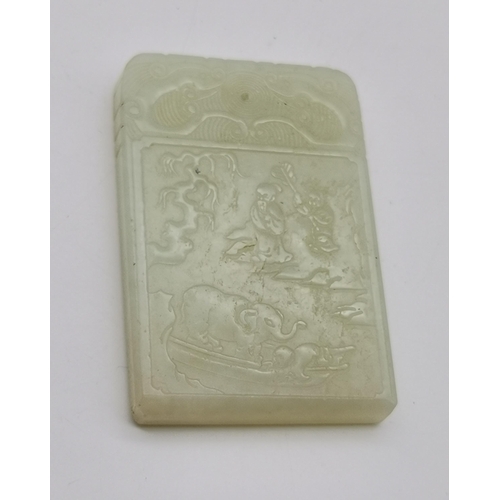 180 - A Chinese celadon jade pendant plaque, rectangular with rounded top corners, carved to the front wit... 