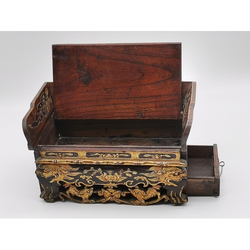 19 - A small Chinese hardwood table-top casket in the form of a bench seat, c.1880, with a pierced, carve... 