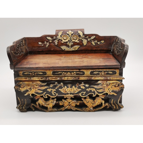 19 - A small Chinese hardwood table-top casket in the form of a bench seat, c.1880, with a pierced, carve... 