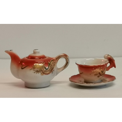 195 - Miniature Teapot with cup and saucer - dragon decor in orange and golds plus three Sanxing Fu Lu Sho... 